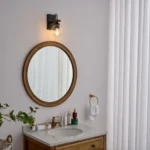 This wall sconce blends two styles, American industrial and farmhouse, with a sturdy base for use in wet environments. The mounting direction can be either up or down, and the bulb needs to be purchased on its own. This wall sconce is a big hit with home decor bloggers on instagram, so hopefully this wall sconce fixture will give your home a new look as well.