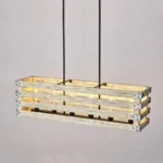 Farmhouse in its elegance, this wood rectangle linear chandelier is one of a kind choice for your home. The rectangle shape has a wooden frame that encases 6 bulbs (not included) with a linear design. Give your kitchen island, dining room, or entryway a refined traditional look with the Era 6 Chandelier. The wood rectangle linear chandelier keeps its farmhouse charms and will shine its brightest when installed in a home with wood nature to strengthen the warmth.