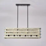 Farmhouse in its elegance, this wood rectangle linear chandelier is one of a kind choice for your home. The rectangle shape has a wooden frame that encases 6 bulbs (not included) with a linear design. Give your kitchen island, dining room, or entryway a refined traditional look with the Era 6 Chandelier. The wood rectangle linear chandelier keeps its farmhouse charms and will shine its brightest when installed in a home with wood nature to strengthen the warmth.
