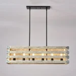 Farmhouse in its elegance, this wood rectangle linear chandelier is one of a kind choice for your home. The rectangle shape has a wooden frame that encases 6 bulbs (not included) with a linear design. Give your kitchen island, dining room, or entryway a refined traditional look with the Era 6 Chandelier. The wood rectangle linear chandelier keeps its farmhouse charms and will shine its brightest when installed in a home with wood nature to strengthen the warmth.
