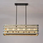 Farmhouse in its elegance, this wood rectangle linear chandelier is one of a kind choice for your home. The rectangle shape has a wooden frame that encases 6 bulbs (not included) with a linear design. Give your kitchen island, dining room, or entryway a refined traditional look with the Era 6 Chandelier. The wood rectangle linear chandelier keeps its farmhouse charms and will shine its brightest when installed in a home with wood nature to strengthen the warmth.