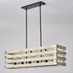 Farmhouse in its elegance, this wood rectangle linear chandelier is one of a kind choice for your home. The rectangle shape has a wooden frame that encases 6 bulbs (not included) with a linear design. Give your kitchen island, dining room, or entryway a refined traditional look with the Era 6 Chandelier. The wood rectangle linear chandelier keeps its farmhouse charms and will shine its brightest when installed in a home with wood nature to strengthen the warmth.