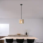 The pendant light’s wood textured framework enhances the farmhouse accent, as well as gives a retro feeling to the house. This light fixture captures the essence of a design era known for its clean lines, organic forms, and functional elegance, now revitalized for today’s discerning tastes. Ideal for a foyer, dining room, kitchen, breakfast nook, entryway, or bedroom in rustic farmhouse-style settings.
