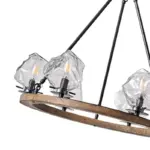 Farmhouse style meets modern minimalist on this Crystal Wood Flyer Chandelier. This vintage-style linear chandelier is compatible with sloped ceilings. 6 irregularly shaped glass lampshade perches on the wooden round base, each designed to house an E12 candelabra base bulb (not included) that adds a candle style to this linear chandelier. Let the warm glow of this embrace you with this farmhouse kitchen island chandelier rustic matte black and wood-like finish.