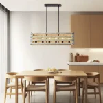 Farmhouse in its elegance, this wood rectangle linear chandelier is one of a kind choice for your home. The rectangle shape has a wooden frame that encases 6 bulbs (not included) with a linear design. Give your kitchen island, dining room, or entryway a refined traditional look with the Era 6 Chandelier. The wood rectangle linear chandelier keeps its farmhouse charms and will shine its brightest when installed in a home with wood nature to strengthen the warmth.