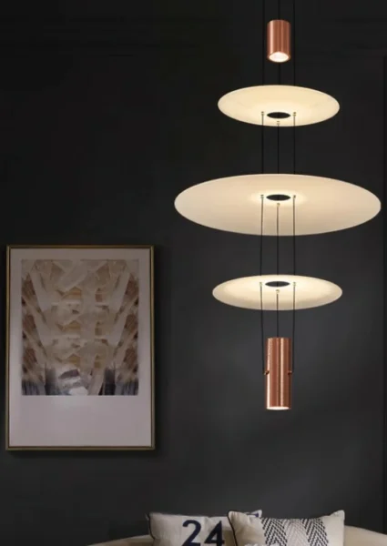 This pendant light has a light source at each end and three frosted glass discs in the center, which allows for better light distribution.