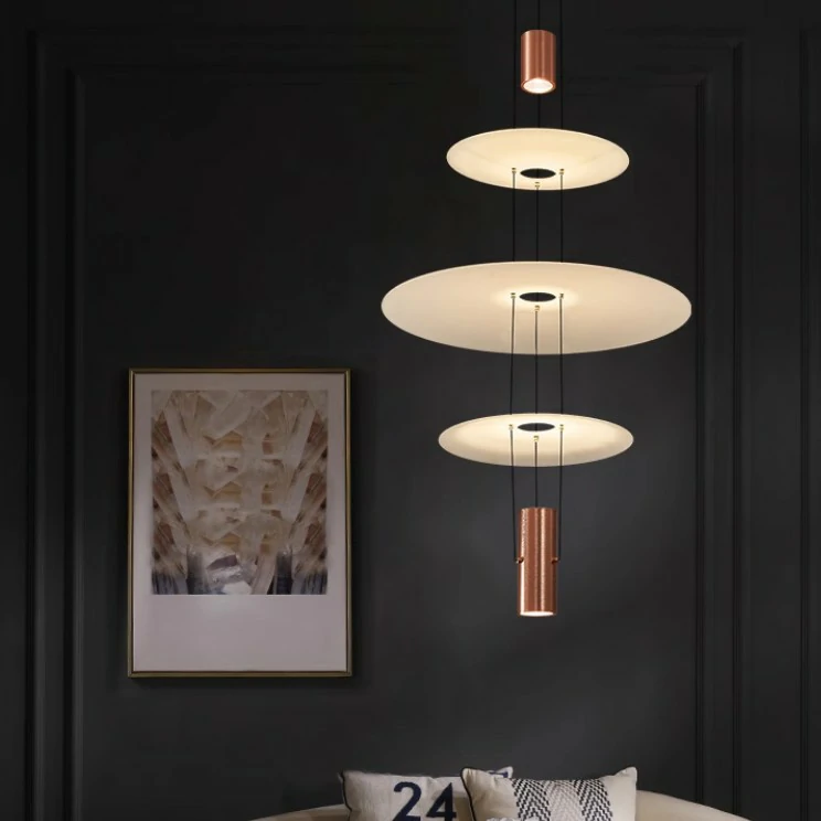 This pendant light has a light source at each end and three frosted glass discs in the center, which allows for better light distribution.