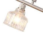 A minimalist masterpiece that seamlessly blends captivating design with functional brilliance, this chandelier transcends the ordinary. Featuring hand-blown glass pendant that commands attention from above, this chandelier will effortlessly accent a space of any size. Suspended elegantly from a sleek metal, the chandelier allows light to playfully dance within its clear glass confines, creating a mesmerizing interplay of shadows and illumination. Combining high-quality metal construction and adjustable height functionality, this pendant light fixture offers a unique lighting experience.