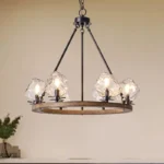 Farmhouse style meets modern minimalist on this Crystal Wood Flyer Chandelier. This vintage-style linear chandelier is compatible with sloped ceilings. 6 irregularly shaped glass lampshade perches on the wooden round base, each designed to house an E12 candelabra base bulb (not included) that adds a candle style to this linear chandelier. Let the warm glow of this embrace you with this farmhouse kitchen island chandelier rustic matte black and wood-like finish.