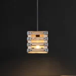 The pendant light’s wood textured framework enhances the farmhouse accent, as well as gives a retro feeling to the house. This light fixture captures the essence of a design era known for its clean lines, organic forms, and functional elegance, now revitalized for today’s discerning tastes. Ideal for a foyer, dining room, kitchen, breakfast nook, entryway, or bedroom in rustic farmhouse-style settings.