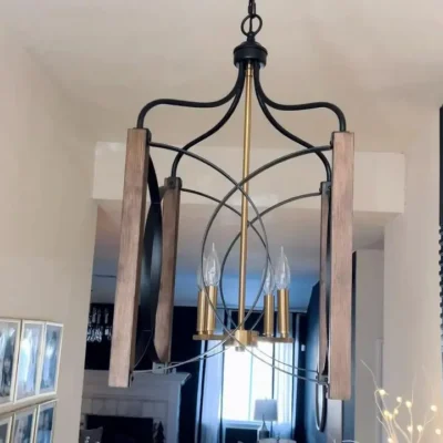 The Calla Cube Pendant is designed in a classic lantern form, an open steel frame structure blends style and simplicity, adding a sense of sophistication to your home. The steel rings house golden candlestick-style fixtures, resembling flickering flames and creating a cozy and romantic ambiance. Each candlestick is equipped with a light bulb(Not included), providing ample illumination and casting a warm and inviting glow throughout the space.The size is perfect. Is designed in a classic lantern form, an open steel frame structure blends style and simplicity and it creates a cozy ambience. Definitely the perfect piece to complete the new look of my entryway.
