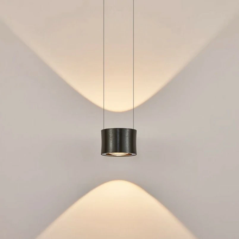 Frey Lens Pendant Light contains two light sources with an illumination area of 6-10 square meters, making it ideal for use as a bedside lamp in your bedroom. The lampshade is made of aluminum and glass. After repeated polishing and polishing processes, the surface of the lamp body presents a luxurious metallic texture.
