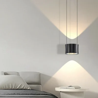 Frey Lens Pendant Light contains two light sources with an illumination area of 6-10 square meters, making it ideal for use as a bedside lamp in your bedroom. The lampshade is made of aluminum and glass. After repeated polishing and polishing processes, the surface of the lamp body presents a luxurious metallic texture.