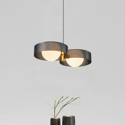 The Piaget Vintage 2 Pendant Light lamp body is made of fine iron. It has a delicate texture and a high-end touch. The lamp body is thick and weighty. The lampshade has a natural curvature, and there is no glare when viewed from the side. A warm light and shadow cuts through the space with a hint of tranquility and brightness, reflecting beautiful light and dark surfaces through different angles of light, and emitting shining and uniform light through the lampshade made of highly transparent material.