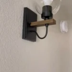 This wall sconce blends two styles, American industrial and farmhouse, with a sturdy base for use in wet environments. The mounting direction can be either up or down, and the bulb needs to be purchased on its own. This wall sconce is a big hit with home decor bloggers on instagram, so hopefully this wall sconce fixture will give your home a new look as well.