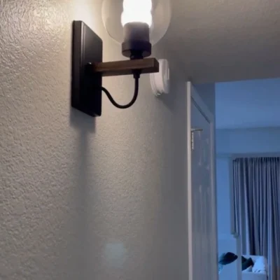 This wall sconce blends two styles, American industrial and farmhouse, with a sturdy base for use in wet environments. The mounting direction can be either up or down, and the bulb needs to be purchased on its own. This wall sconce is a big hit with home decor bloggers on instagram, so hopefully this wall sconce fixture will give your home a new look as well.