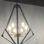 Diamond Epazo Pendant Light is a very American industrial style pendant light, the overall frame is made of black stainless steel with an openwork diamond frame, the center base is made of brass in the shape of a candelabra, and there are a total of six light sources to provide illumination, which is perfect for your minimalist home décor.